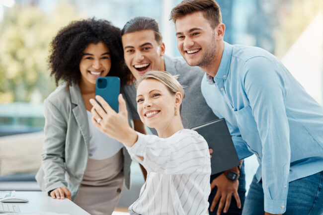 Teamwork selfie, phone and playful or fun people for social media, contact us or about us website p.